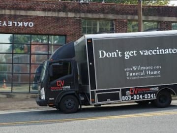 Truck delivers 'funeral home' reverse psychology to the unvaccinated